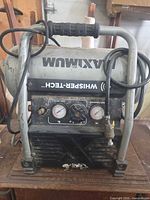 Front view showing gauges, regulator, brand markings and full frame