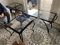 Coffee table and both end tables together on rug