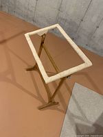 Full view of wooden stand, frame oriented horizontally