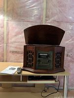 Front view of multimedia console with lid open