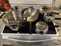 Entire cookware set on stovetop showing all pieces