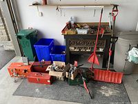 Overview of lot with tool boxes, shovels, vise