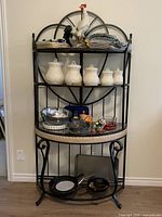 Full view of baker’s rack and all items on shelves