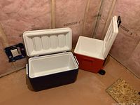 Blue and red coolers opened showing interiors