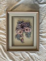 Front view of framed layered paper floral artwork
