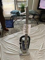 Front view of Shark Euro-Pro X upright vacuum on sheet