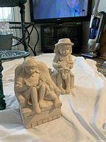 Close view of two resin girl statues