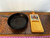 Top view of 12-in skillet and wooden board