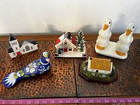 All five decorative pieces arranged on surface