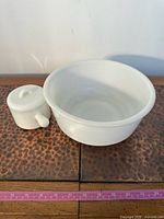 Both Avon milk glass pieces side by side