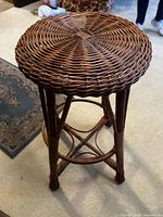 Full view of brown wicker bar stool