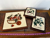 Front view of three ceramic wall plaques