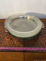 Stack of three clear glass pie plates