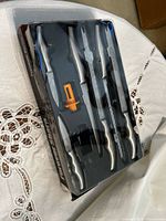 Boxed Forever Sharp knife set with six knives and orange sharpener visible through window