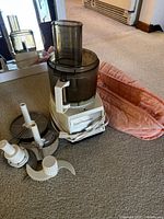 Processor base, bowl, lid, discs, blades visible