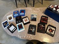 Overall view showing thirteen 8-track cartridges on table