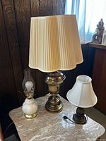 All three lamps on tabletop showing relative sizes and styles