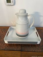 Carafe with lid on tray
