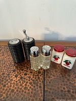 All six shakers grouped on tabletop