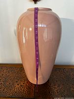 Front view showing full height with tape measure indicating approximately 18–24 in