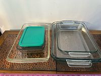 Stacked glass baking dishes with storage container and lid