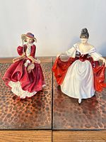 Front view of both figurines side by side