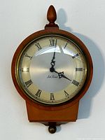 Front view of Seth Thomas wall clock showing full case and dial