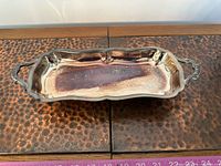 Top view showing engraved interior, shape, handles