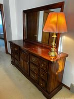 Front view of dresser with mirror and lamp showing overall design