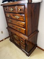 Full view of solid wood highboy dresser showing walnut finish and drawer layout