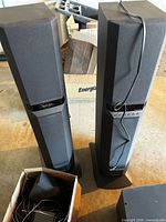Front view of two Sony tower speakers with cables