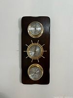 Full frontal view of the plaque showing all three gauges