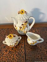 Full three-piece set: teapot with lid, sugar bowl with lid, creamer