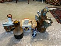 Group shot of all five vintage liquor decanters and bottles