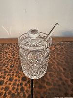 Jam pot assembled with lid and spoon inserted