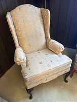 Full view of wingback chair front profile
