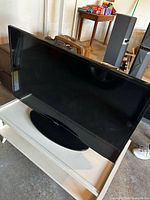 Front view of Samsung flat-screen TV on stand