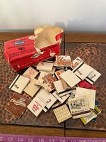 Assorted matchbooks scattered next to Diamond King Size box