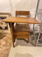 Front view of oak school desk showing attached seat and desk form