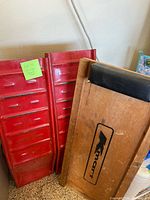 Pair of red ramps standing with Kmart creeper board