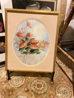 Framed floral print on stand