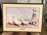 Full framed print showing girl with geese, frame and mat visible