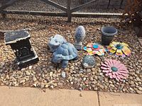 All garden decor items arranged on stone ground