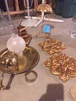 Group shot showing oil lamp, risers, plaques, ring