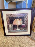 Front view of framed still life print showing pears and wine goblets