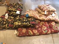 All five cushions laid out showing patterns and sizes