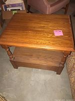 Overall view of side table showing top, shelf, legs