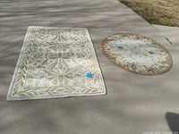 Rectangular and round rugs side by side for full view