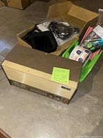 Front view of General Electric radio with surrounding office items in tray