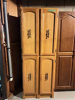 Front view of full cabinet showing four paneled doors and hardware